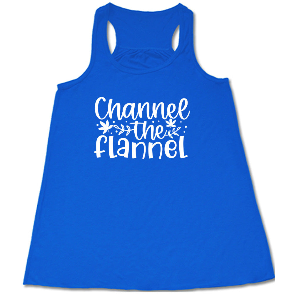 Blue colored flowy tank with fall leaf graphic on it that says "Channel The Flannel"