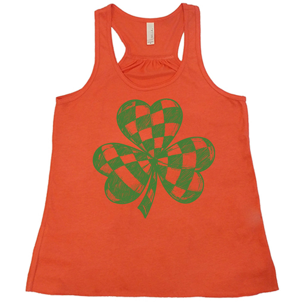 coral flowy tank with the large graphic of a shamrock that is checkered on the inside