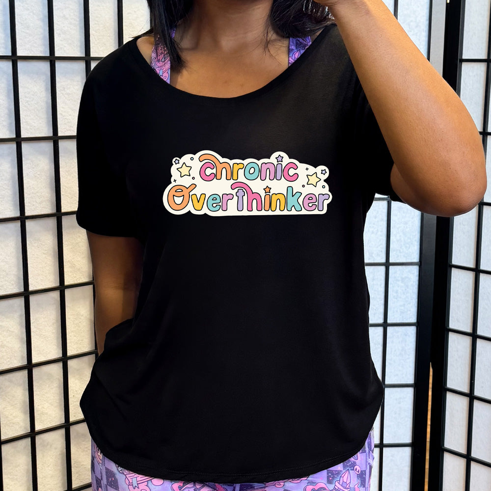 black slouchy shirt with the quote "Chronic Overthinker" on it