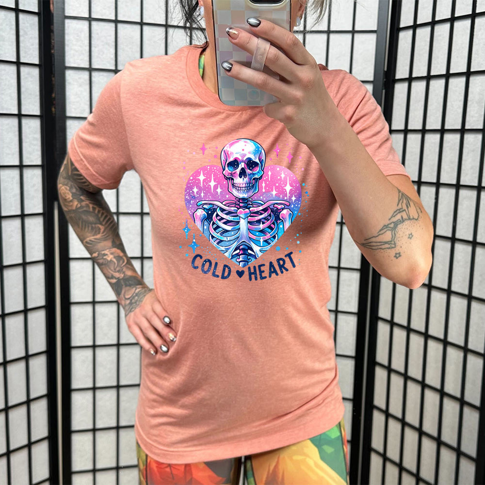 coral shirt with the text "Cold Heart" on it