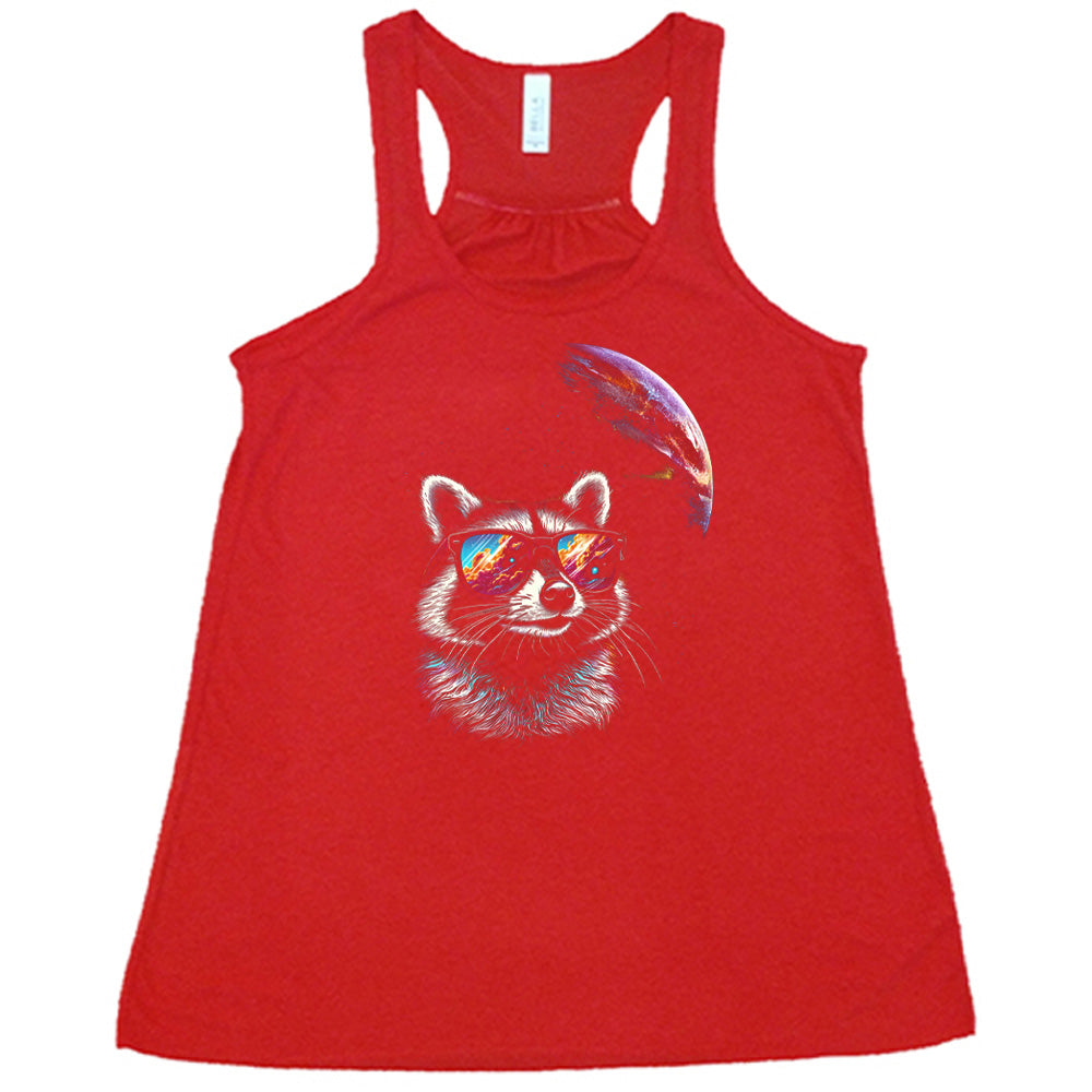 Red colored flowy tank with a raccoon looking into space graphic on it