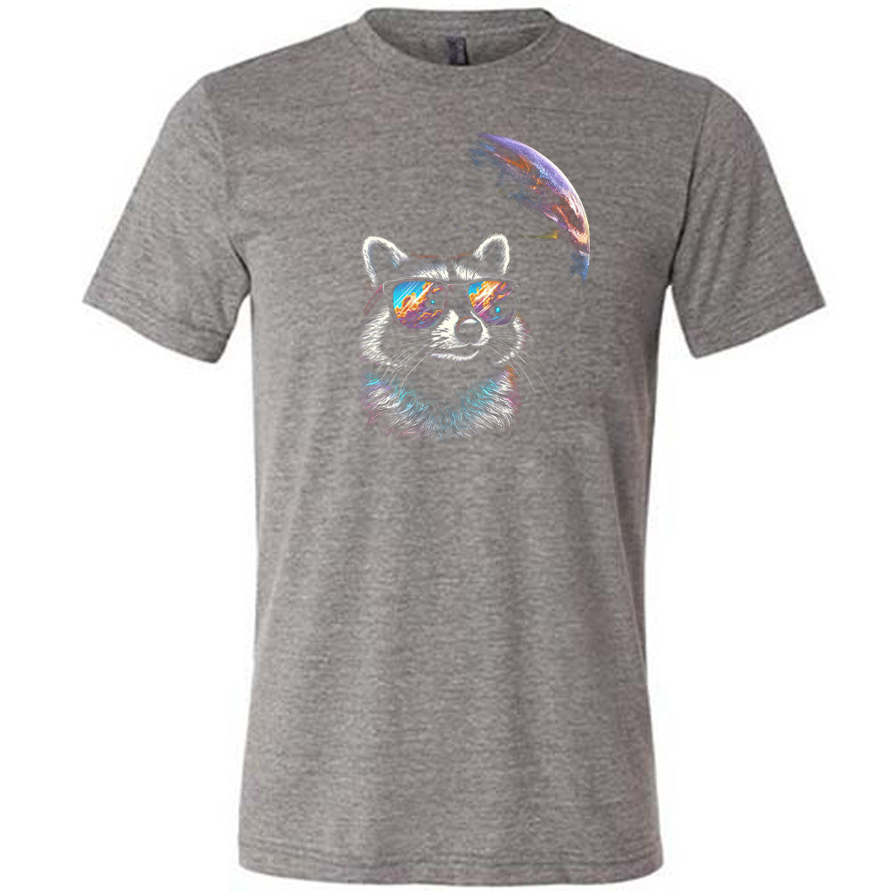 Grey colored shirt with a raccoon looking into space graphic on it