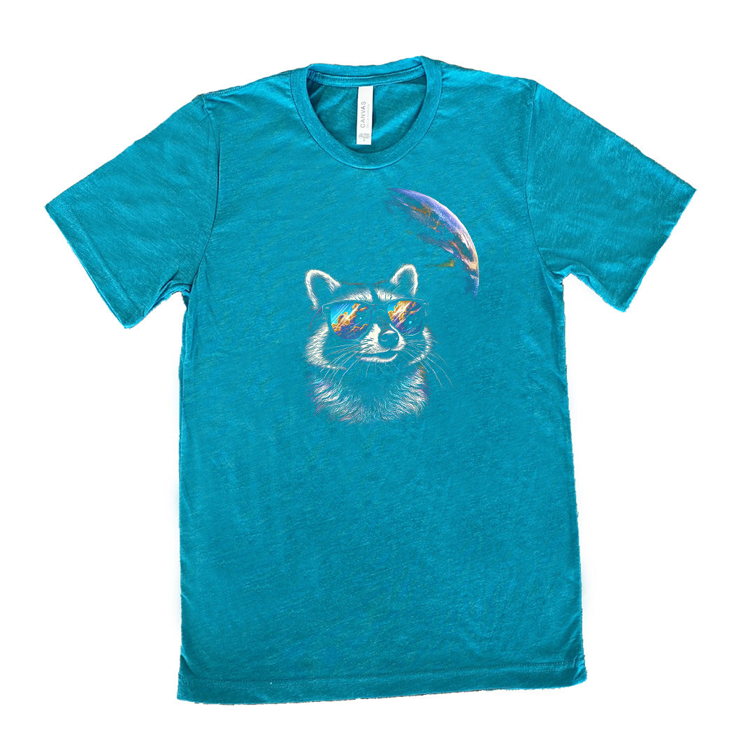 Teal colored shirt with a raccoon looking into space graphic on it