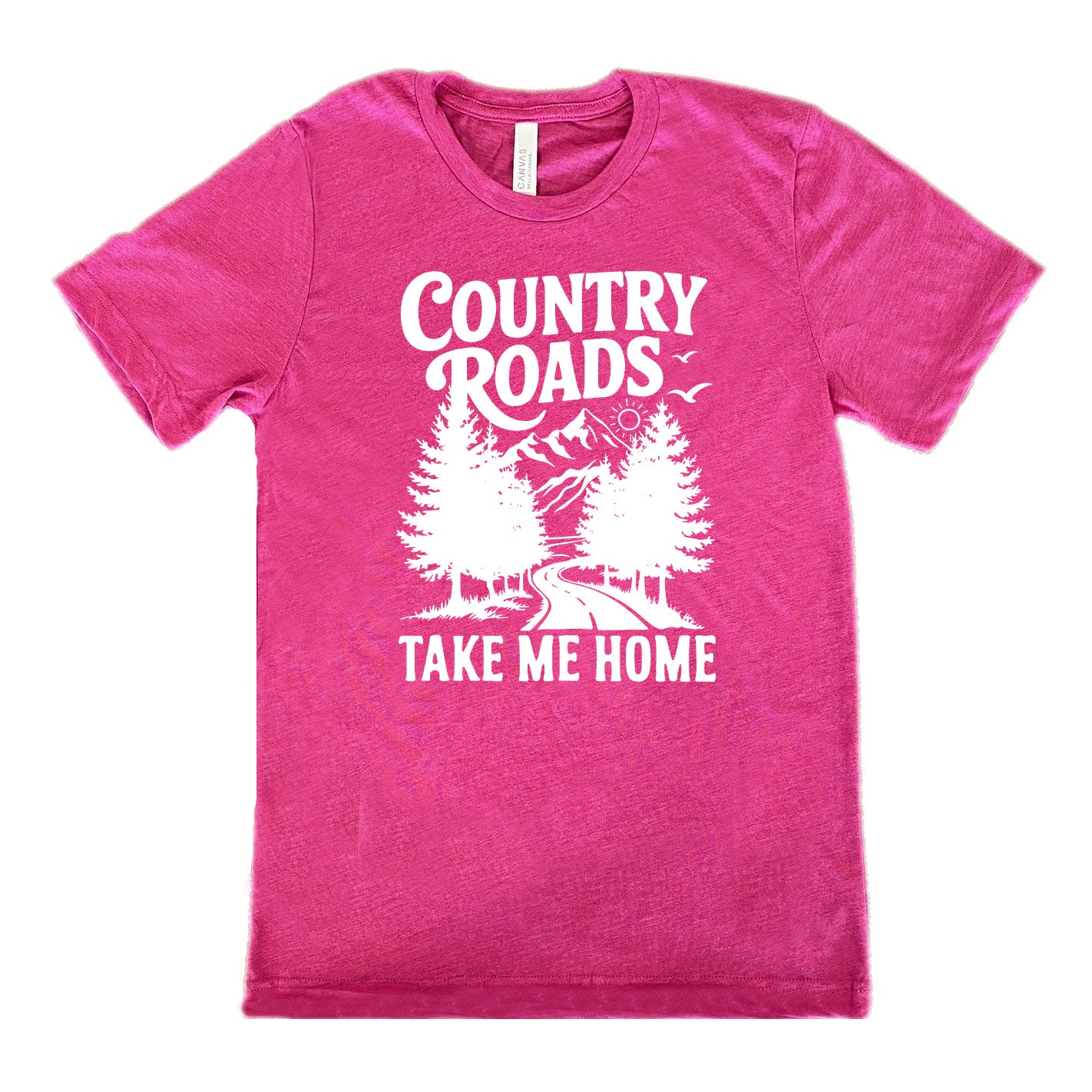 berry unisex tee with the words "country roads take me home" on it, and the graphic of a road going through tall trees, with mountains beyond, and the sun