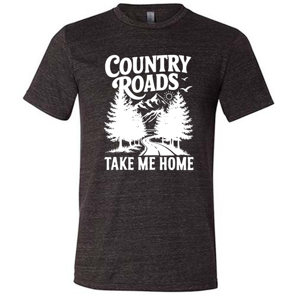 black unisex tee with the words "country roads take me home" on it, and the graphic of a road going through tall trees, with mountains beyond, and the sun