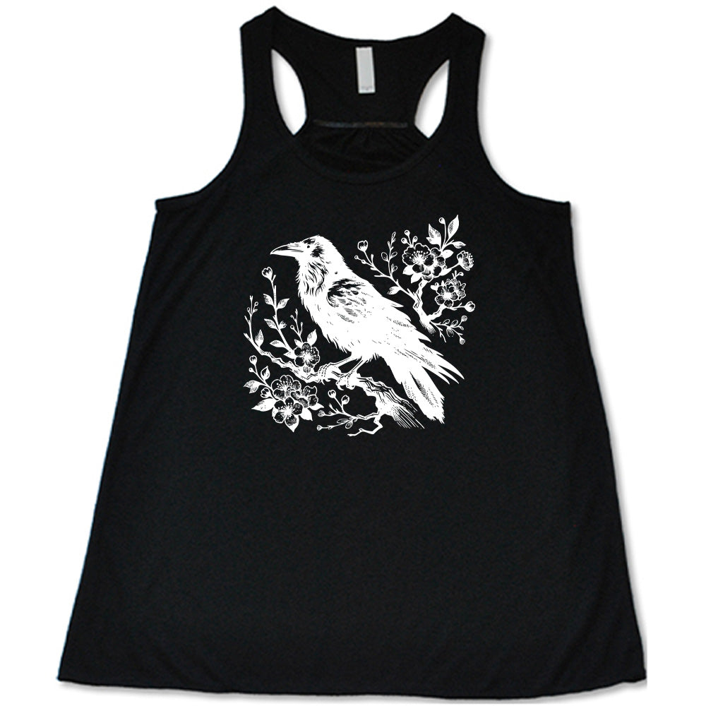 Black colored flowy tank with crow on flowery branch graphic on it