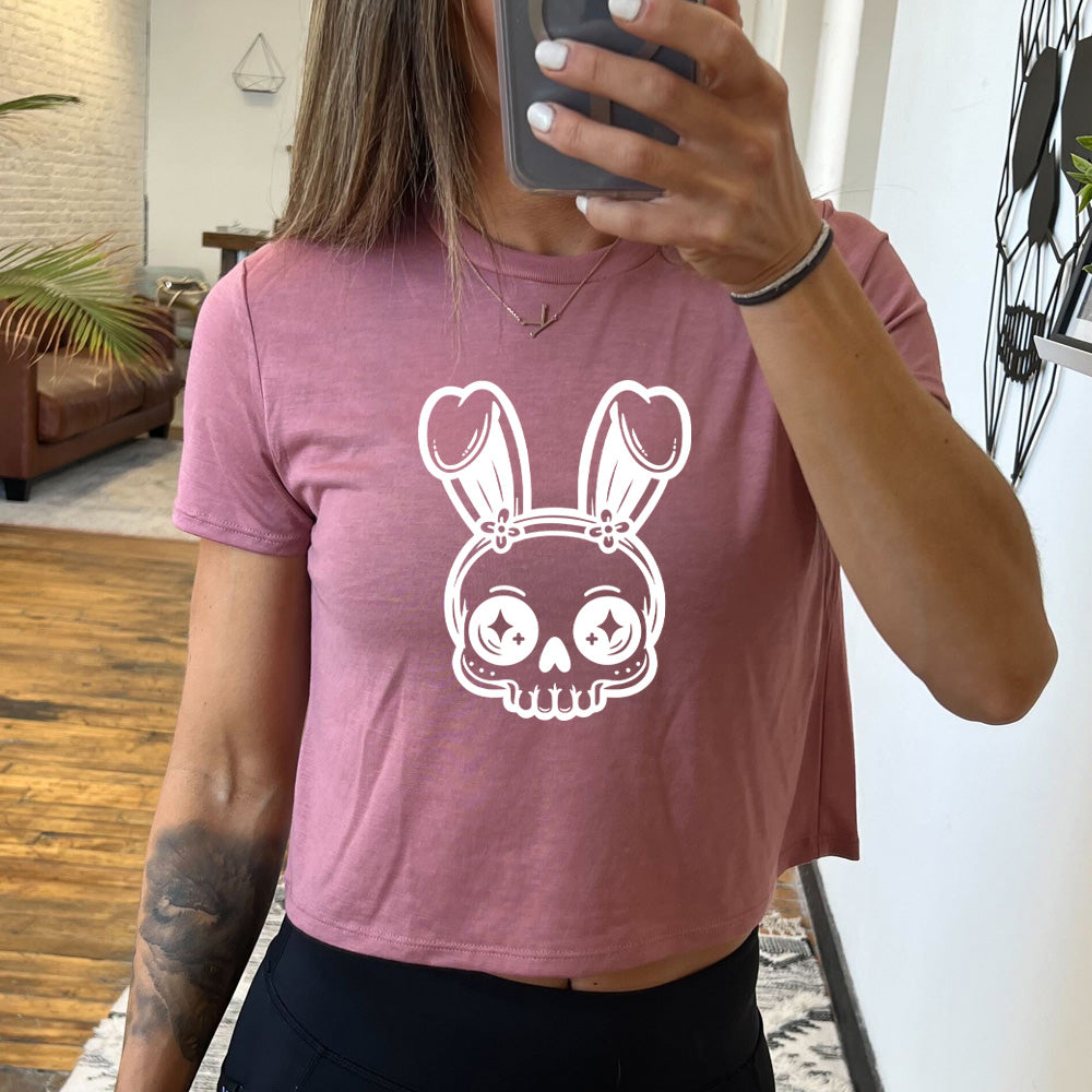 mauve cropped tee with a bunny skull graphic on it