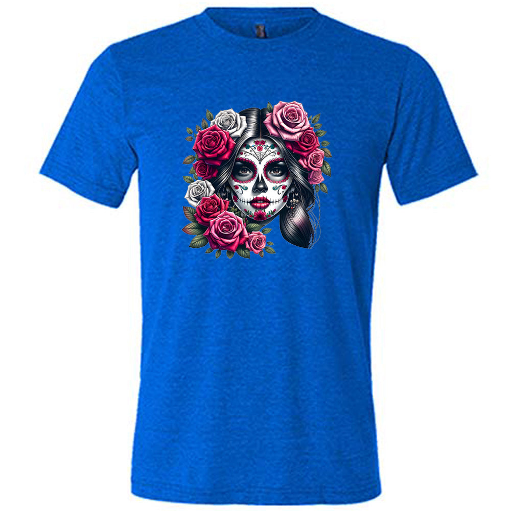 blue shirt with a Day Of The Dead graphic on it