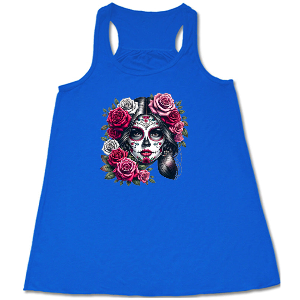 blue shirt with a Day Of The Dead graphic on it
