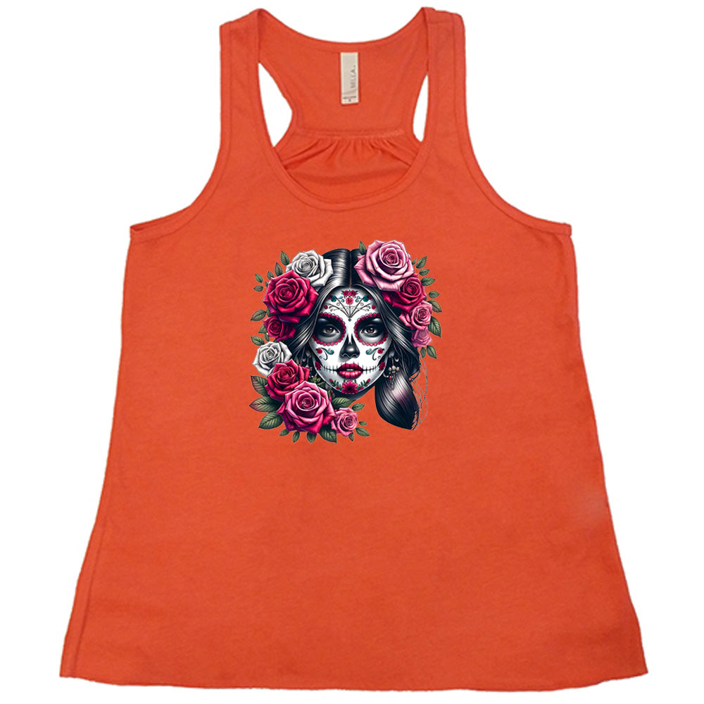 orange shirt with a Day Of The Dead graphic on it