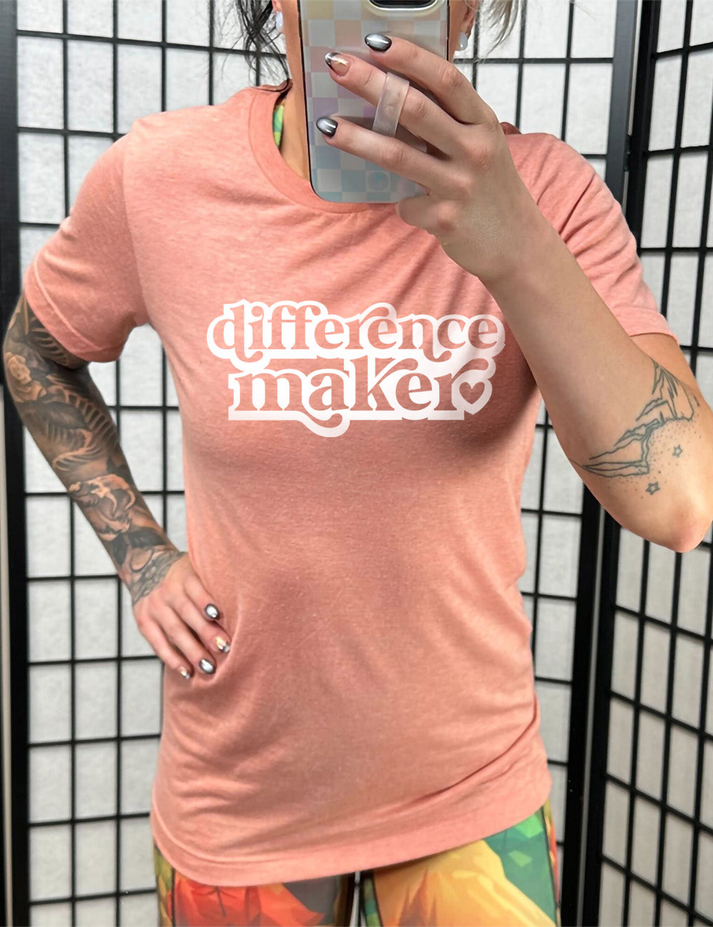 sunset unisex tee with the words "difference maker" followed by a single heart on it