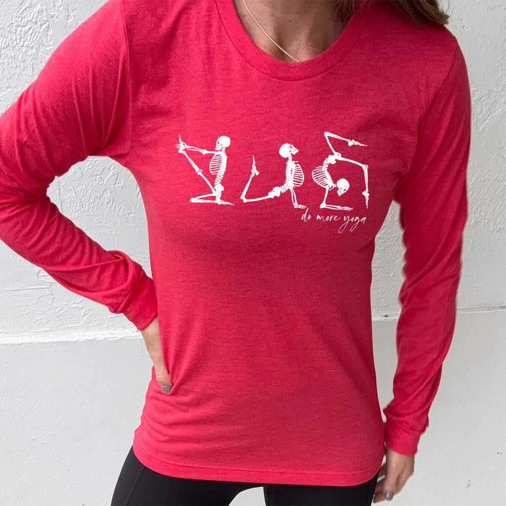 heather red long sleeve shirt with three skeleton graphics doing yoga, with the small words underneath saying "do more yoga"