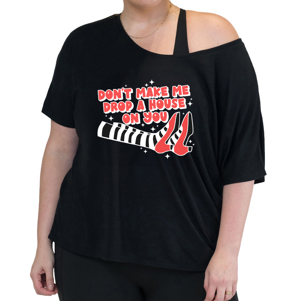 black slouchy shirt with the text "Don't Make Me Drop A House On You" on it