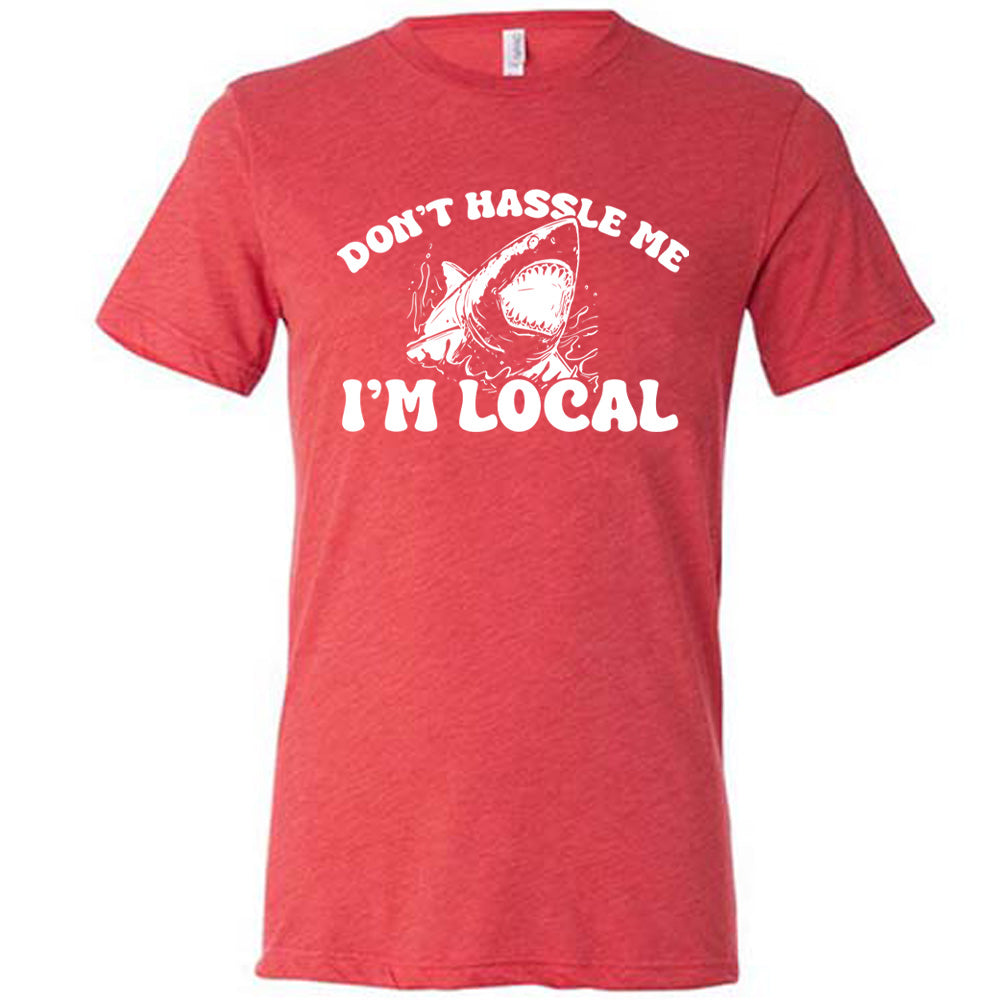 Red colored shirt with a shark graphic on it that says "Don't Hassle Me I'm Local"