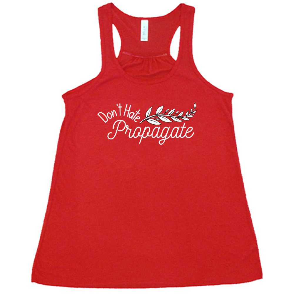 Red colored flowy tank with a plant graphic on it that says "Don't Hate, Propagate"