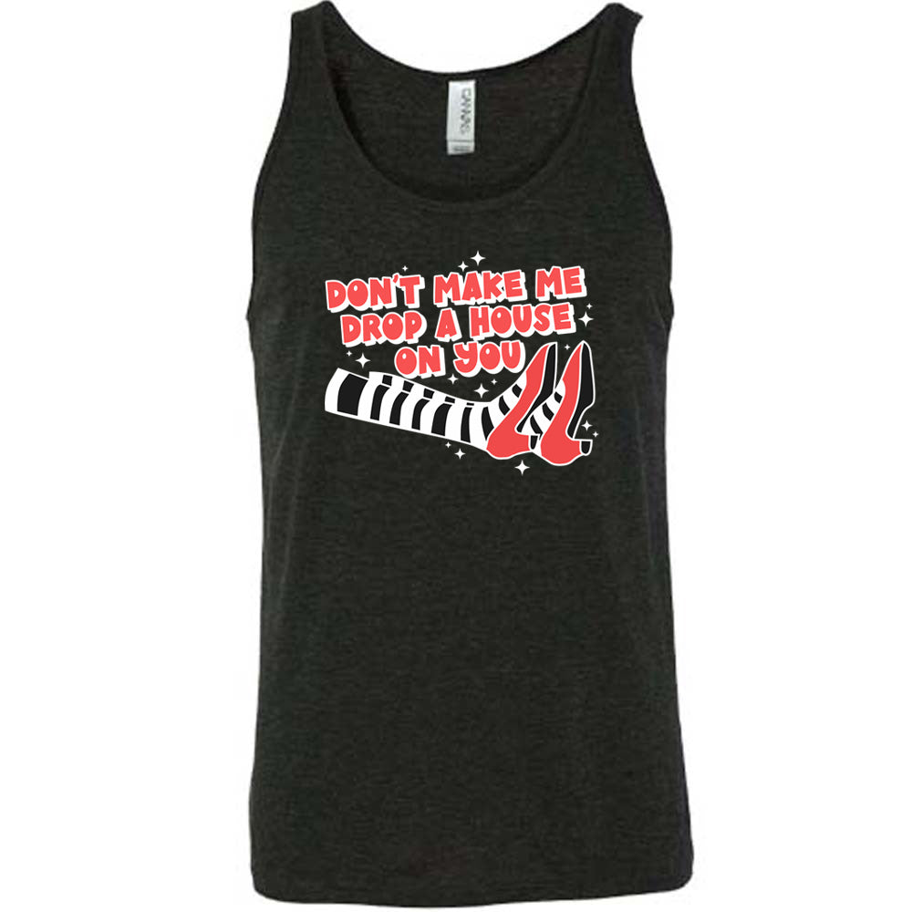 black shirt with the text "Don't Make Me Drop A House On You" on it