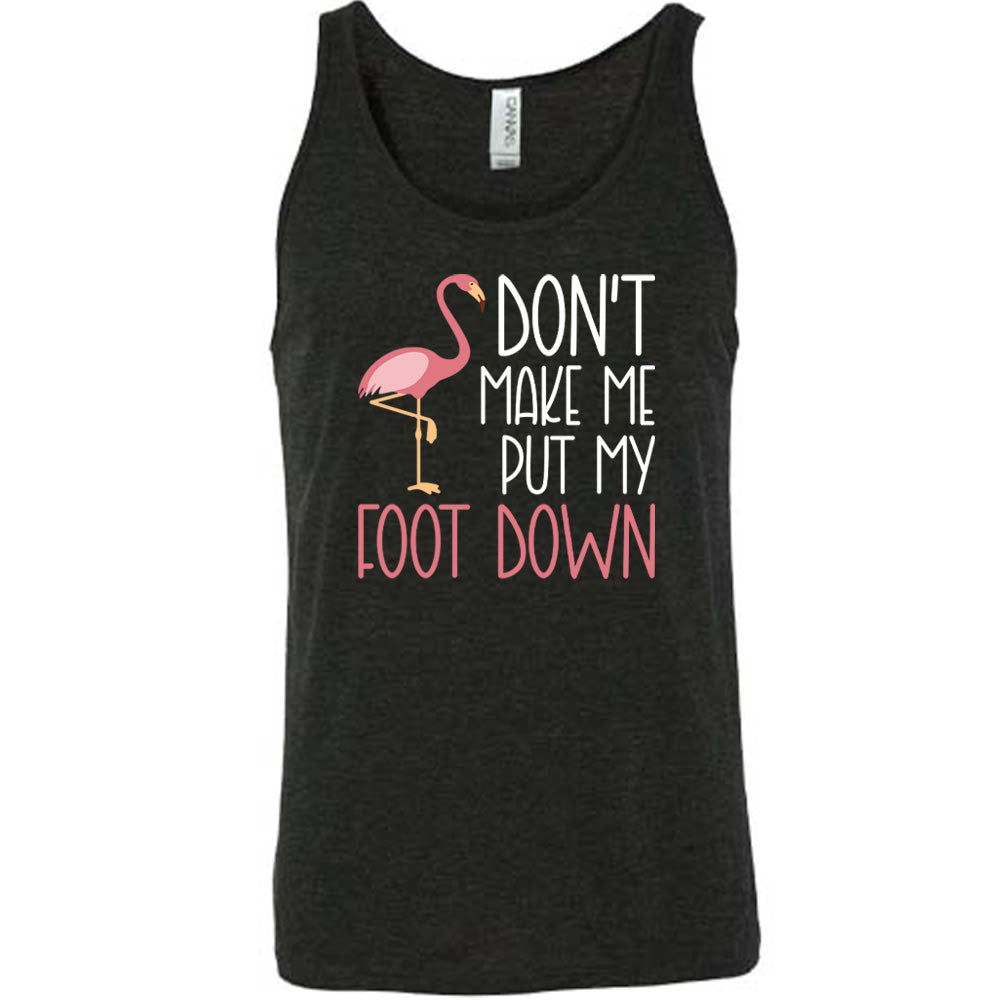 black unisex tank with the words "don't make me put my foot down" on it, with the graphic of a flamingo next to the words, with its foot raised