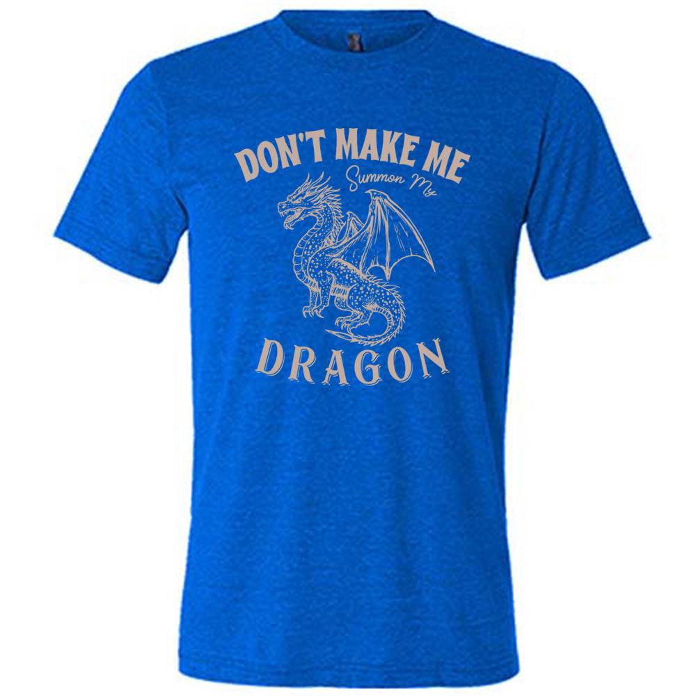 blue unisex tee with the words "don't make me summon my dragon" on it, surrounding the graphic of a fierce-looking dragon