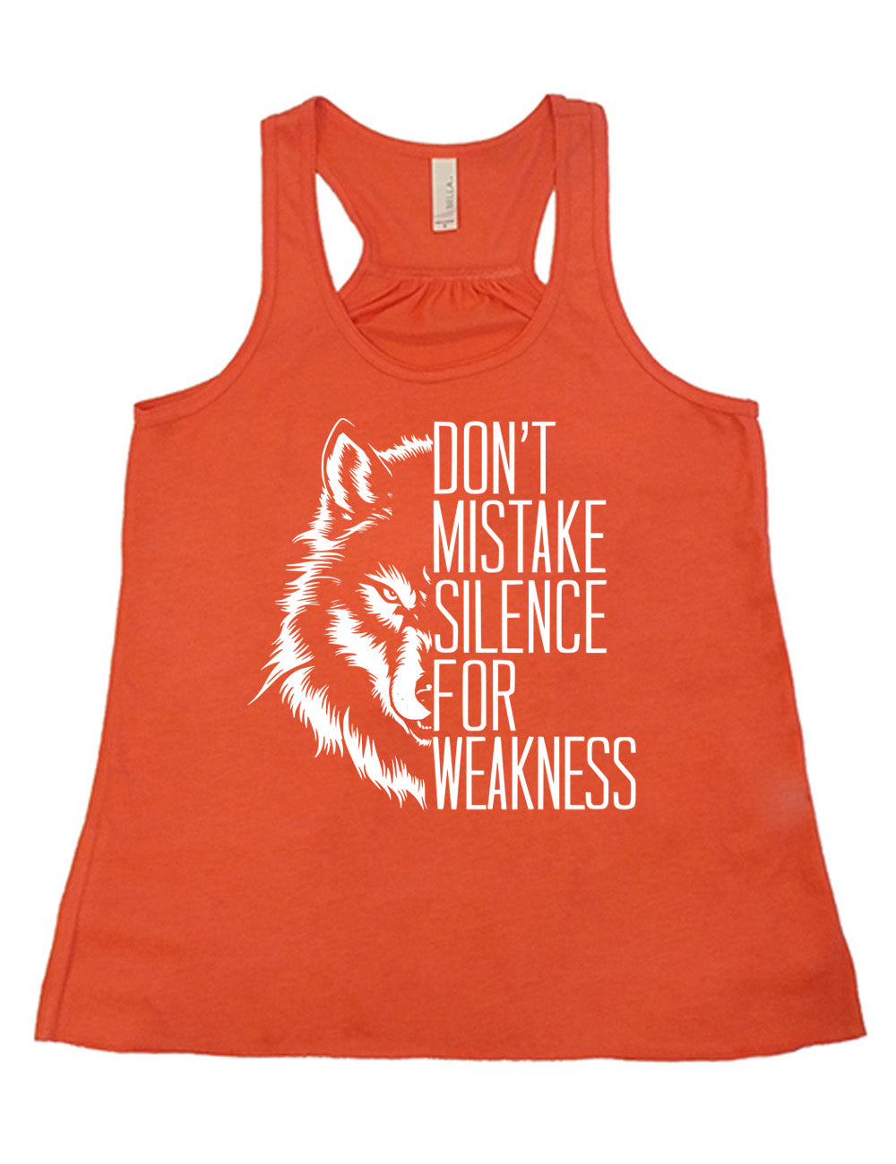 coral flowy racerback tank with the graphic of half a wolf's head, and the words "don't mistake silence for weakness" making up the other half
