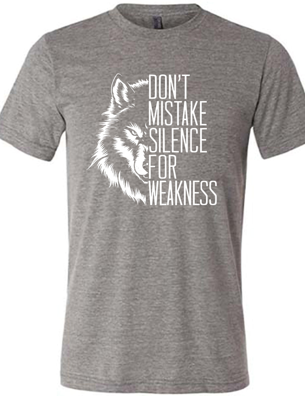 grey unisex tee with the graphic of half a wolf's head, and the words "don't mistake silence for weakness" making up the other half