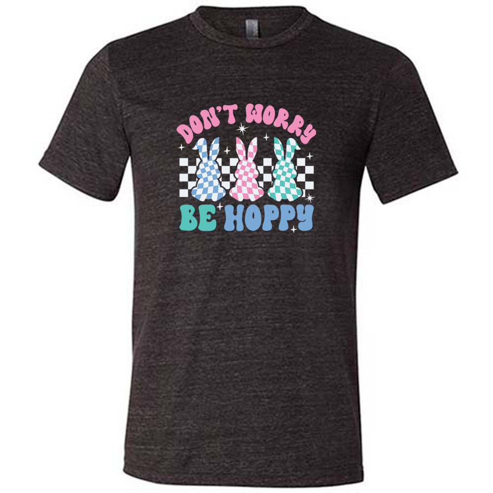 Black colored shirt with a checkered bunny graphic on it that says "Don't Worry Be Hoppy"