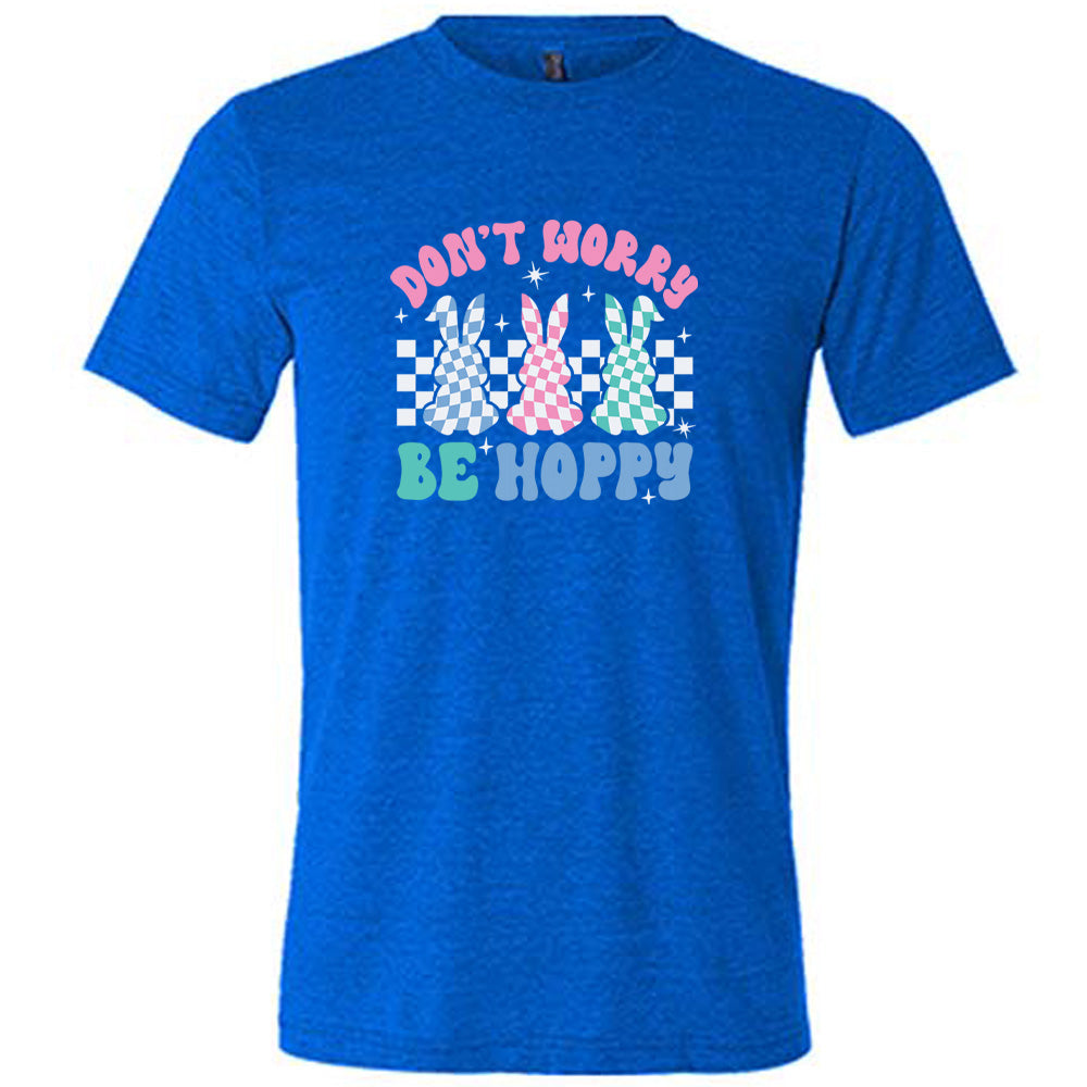 Blue colored shirt with a checkered bunny graphic on it that says "Don't Worry Be Hoppy"