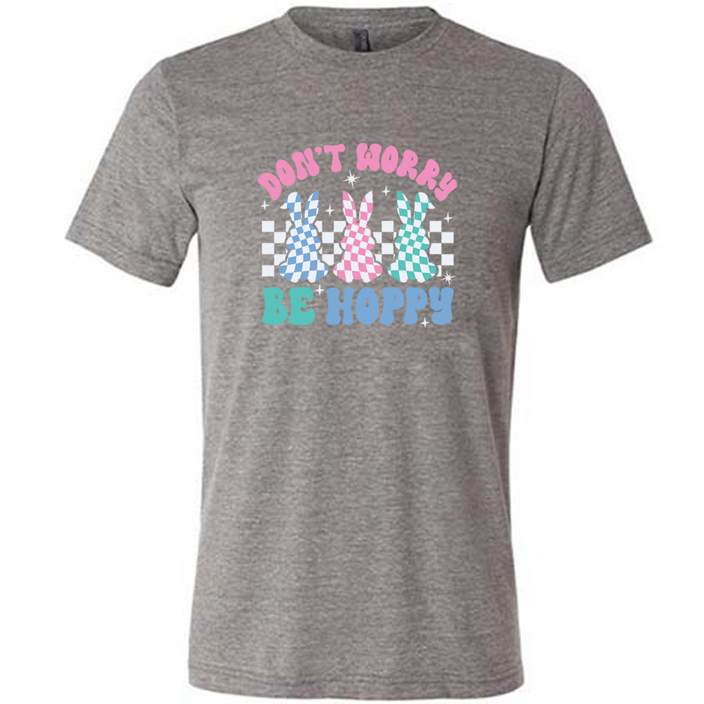 Grey colored shirt with a checkered bunny graphic on it that says "Don't Worry Be Hoppy"