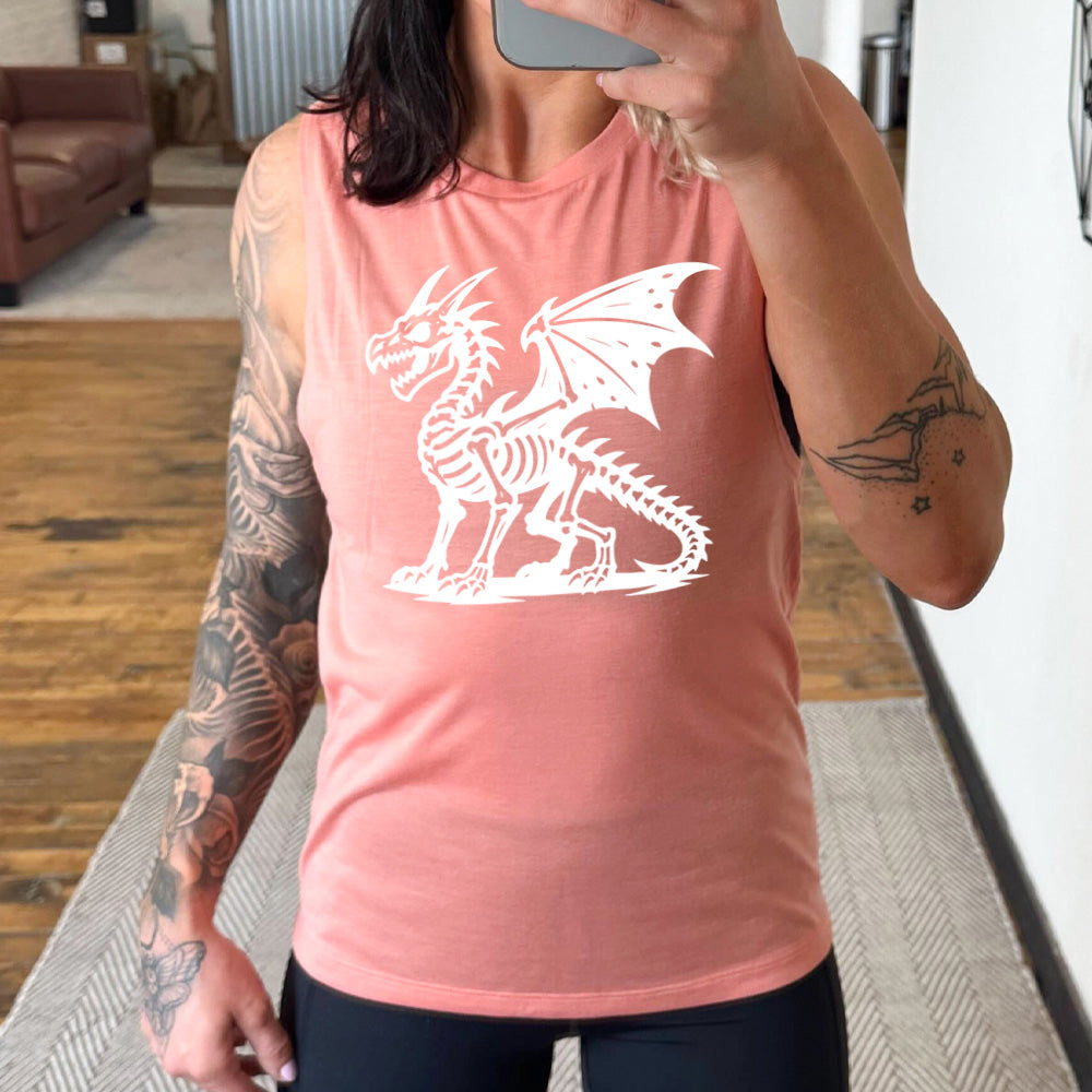 peach muscle tank with the large graphic of a dragon, and its body is its skeleton