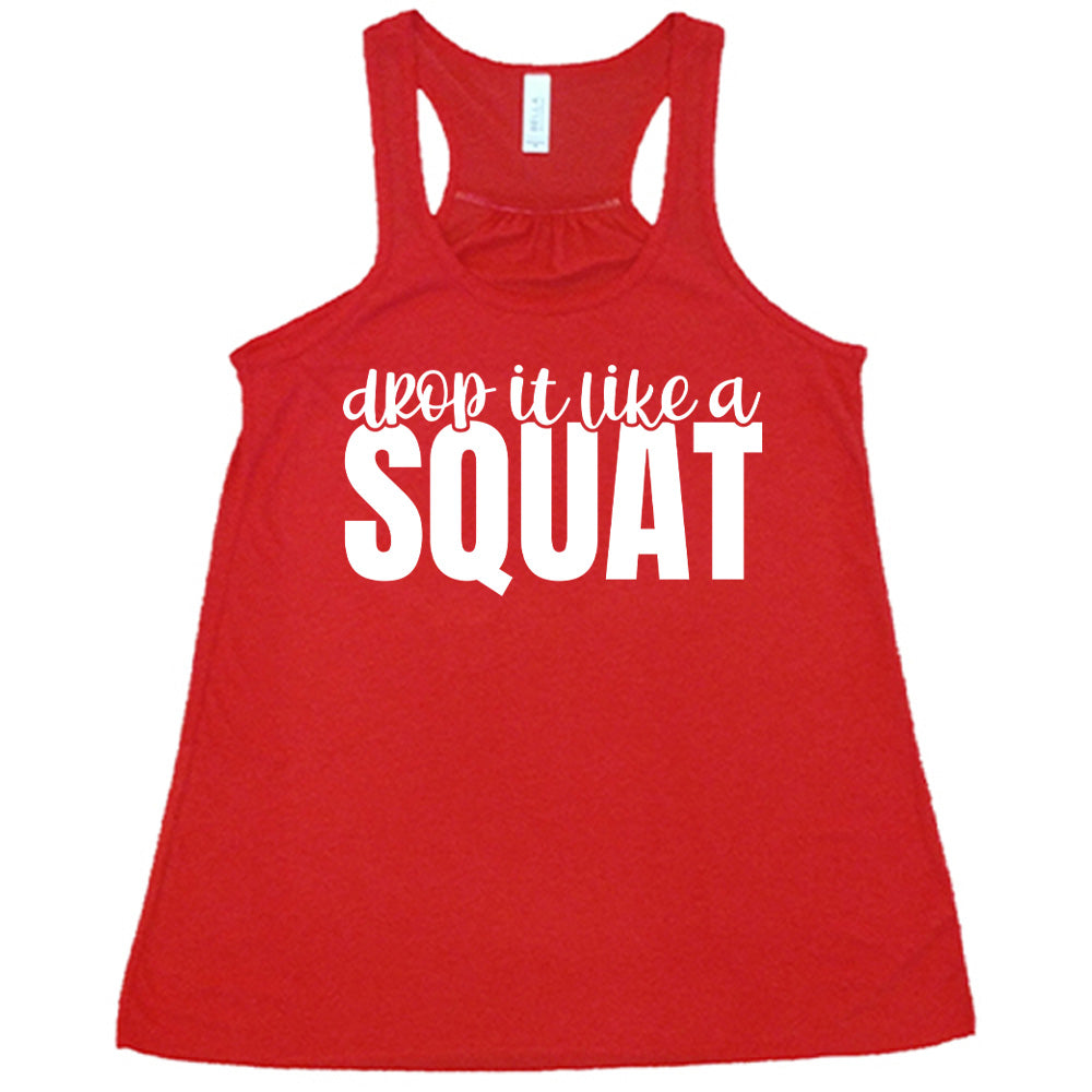 Red flowy tank with Drop it Like a Squat in white lettering