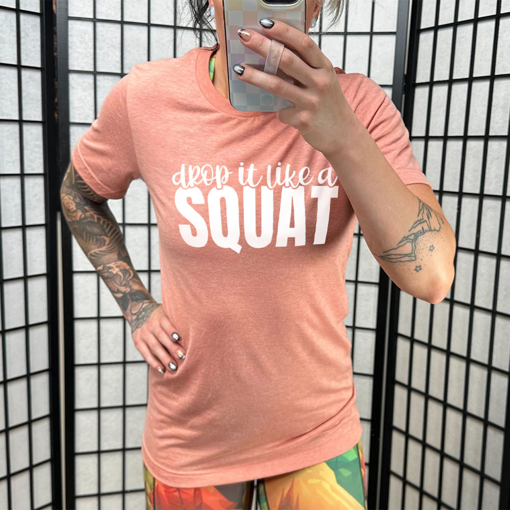 Sunset Unisex Tee with Drop it Like a Squat in white lettering