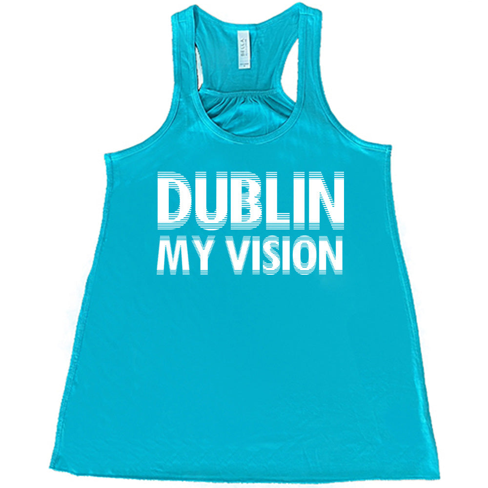 teal flowy tank with the words "dublin my vision" on it, displayed in a way to cause the optical illusion of blurred, doubled vision