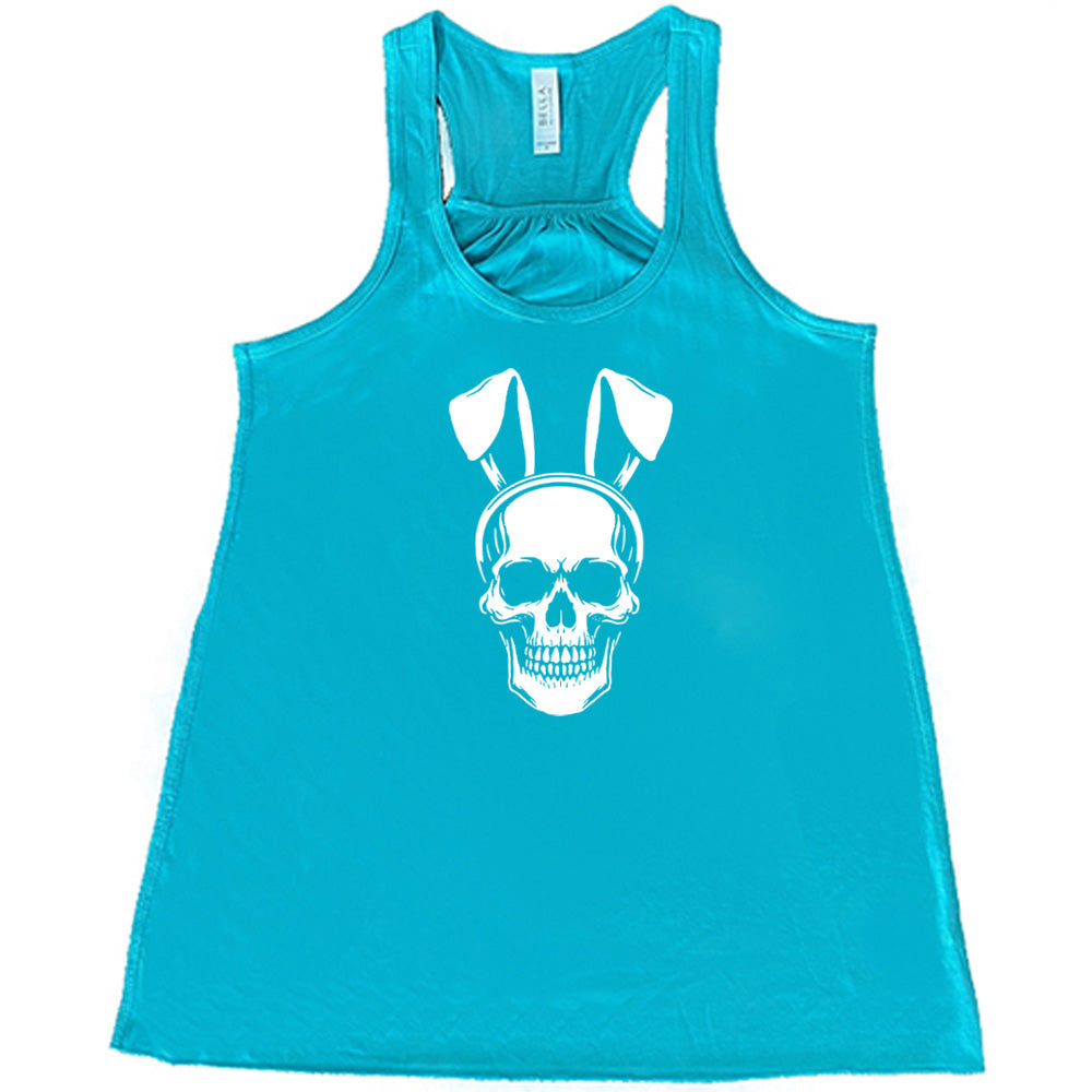 Teal colored flowy tank with a skull wearing bunny ears graphic on it