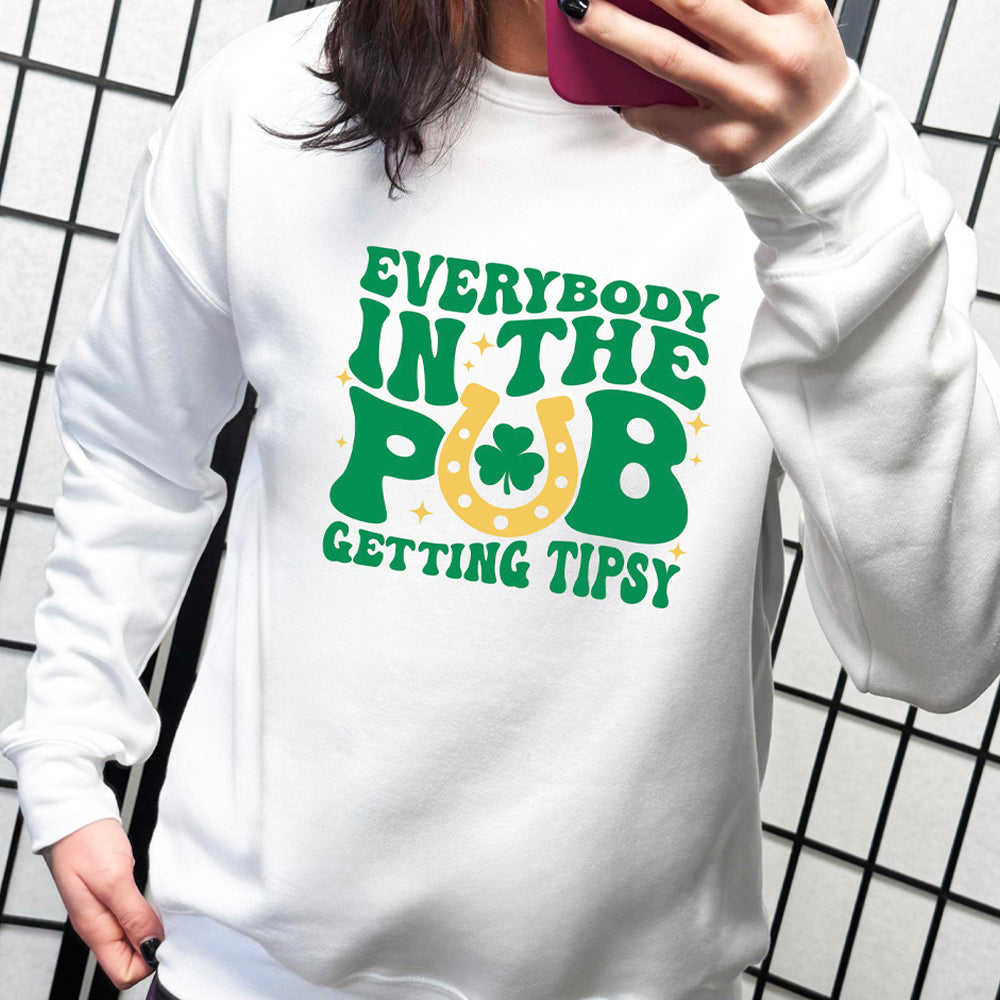 white crewneck with the quote "Everybody In The Pub Getting Tipsy" on it