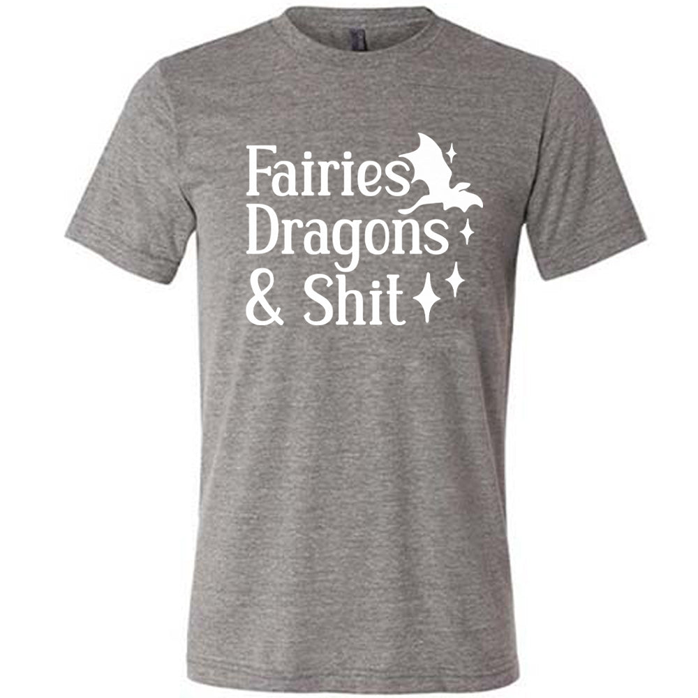 grey unisex tee with the words "fairies dragons & shit" on it, with the small graphic of a dragon and a few stars