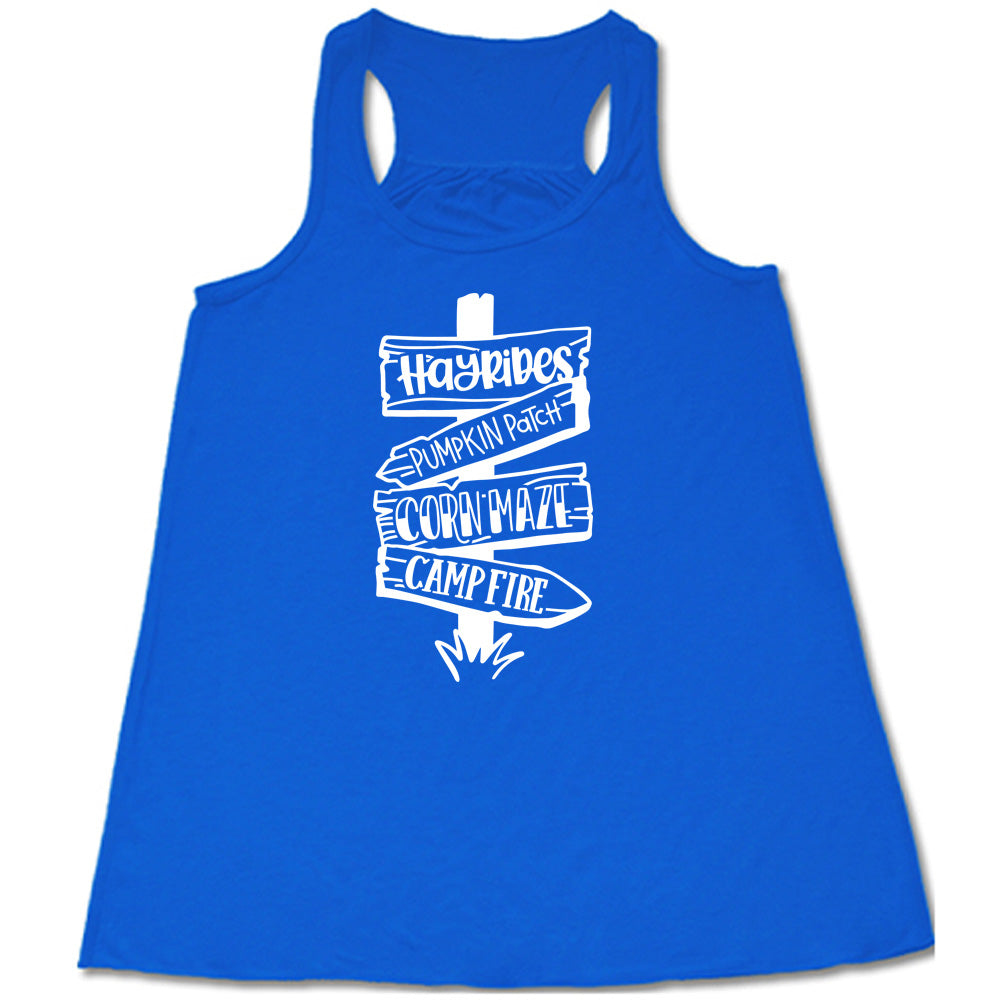 Blue colored flowy tank with fall activities signpost graphic on it that says "Hayrides, Pumpkin Patch, Corn Maze, Campfire"