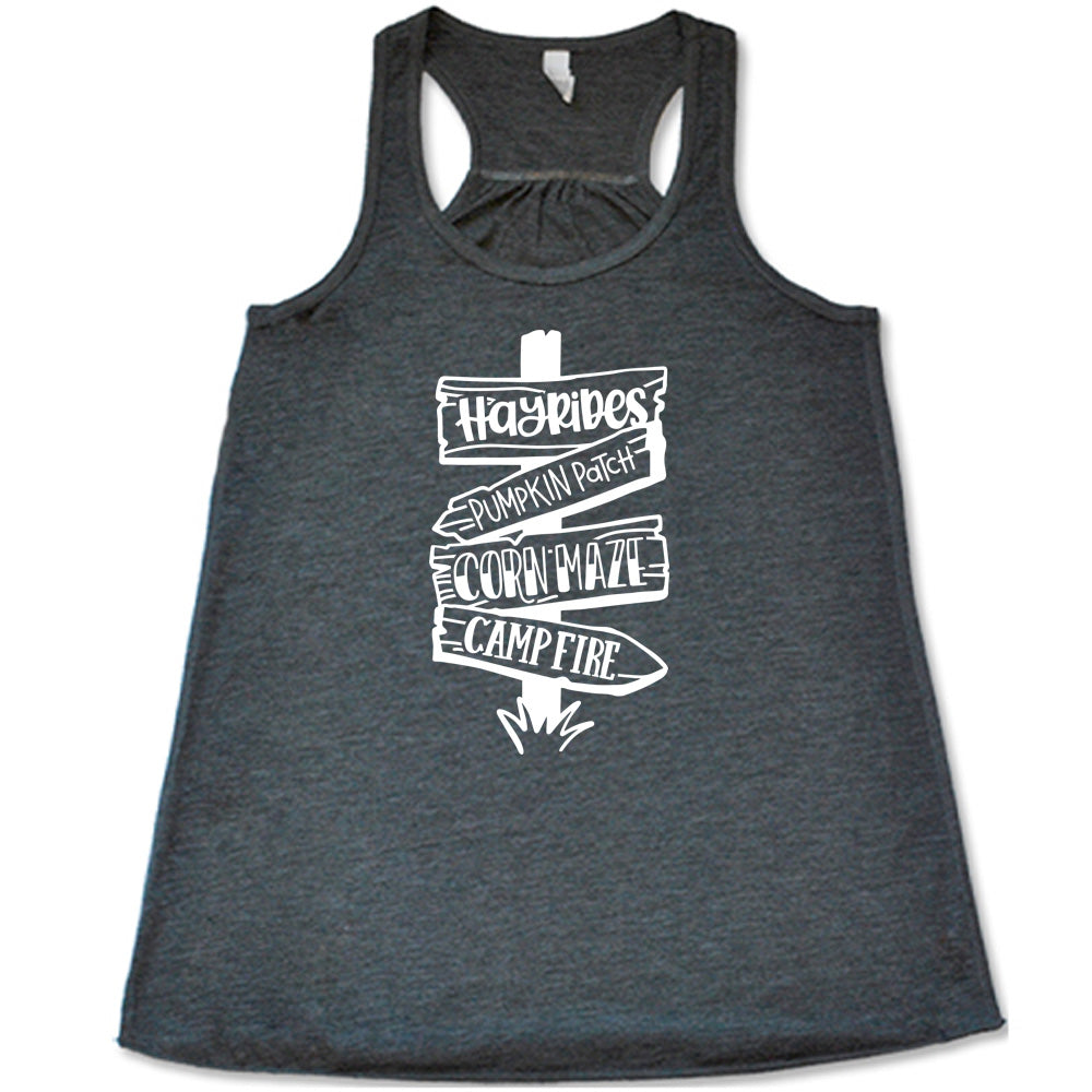 Grey colored flowy tank with fall activities signpost graphic on it that says "Hayrides, Pumpkin Patch, Corn Maze, Campfire"