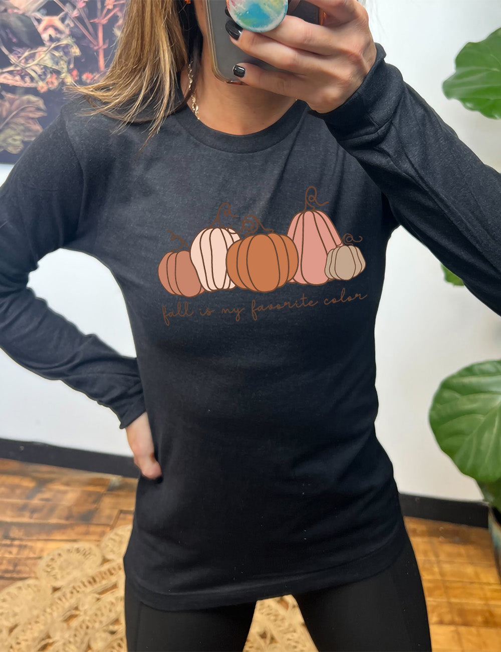 heather black long sleeve shirt with the graphic of five pumpkins of varied shape and color, and the small words underneath saying "fall is my favorite color"