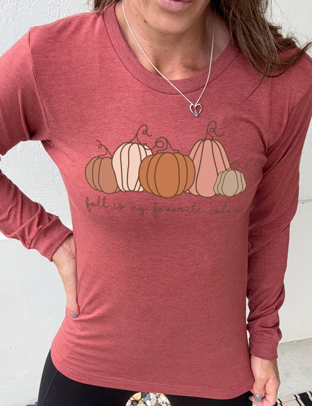 heather clay long sleeve shirt with the graphic of five pumpkins of varied shape and color, and the small words underneath saying "fall is my favorite color"