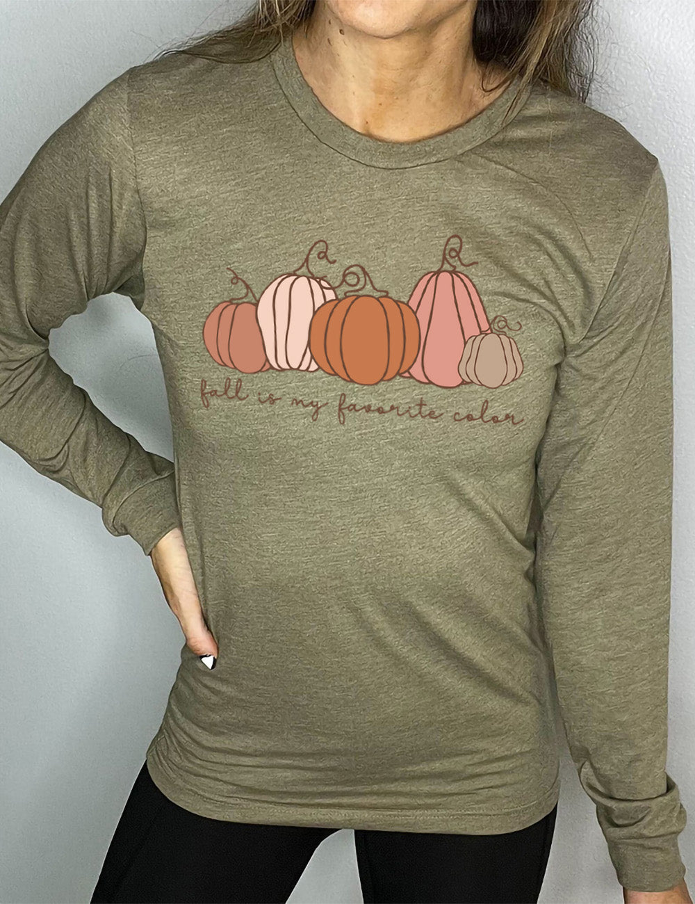 heather olive long sleeve shirt with the graphic of five pumpkins of varied shape and color, and the small words underneath saying "fall is my favorite color"