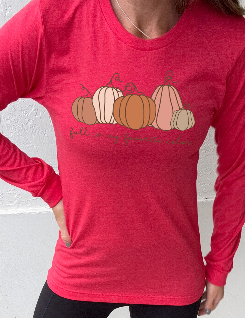 heather red long sleeve shirt with the graphic of five pumpkins of varied shape and color, and the small words underneath saying "fall is my favorite color"
