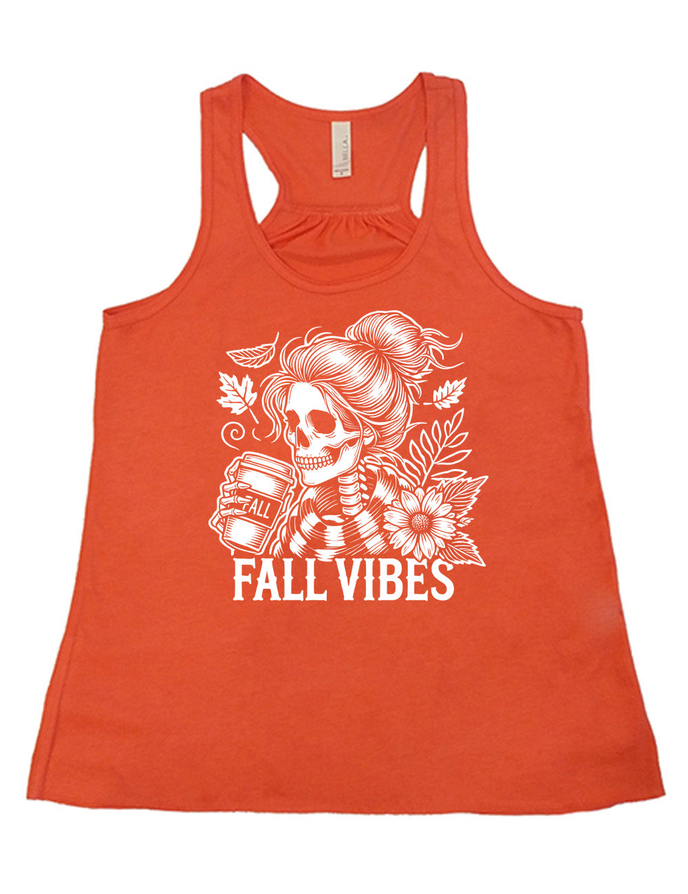 coral flowy racerback tank with the graphic of a skeletal woman, with her hair in a bun, holding a takeaway coffee cup labeled "fall", with a flower and leaves next to her, and the words underneath saying "fall vibes"