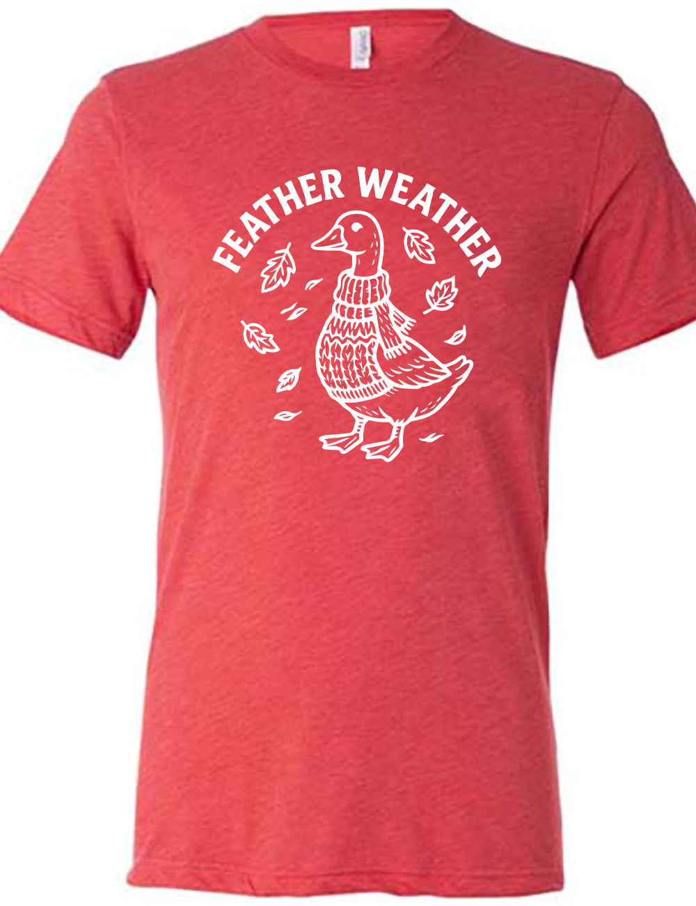 red unisex tee with the graphic of a goose, wearing a scarf and sweater, surrounded by falling leaves, and the words arched over it saying "feather weather"