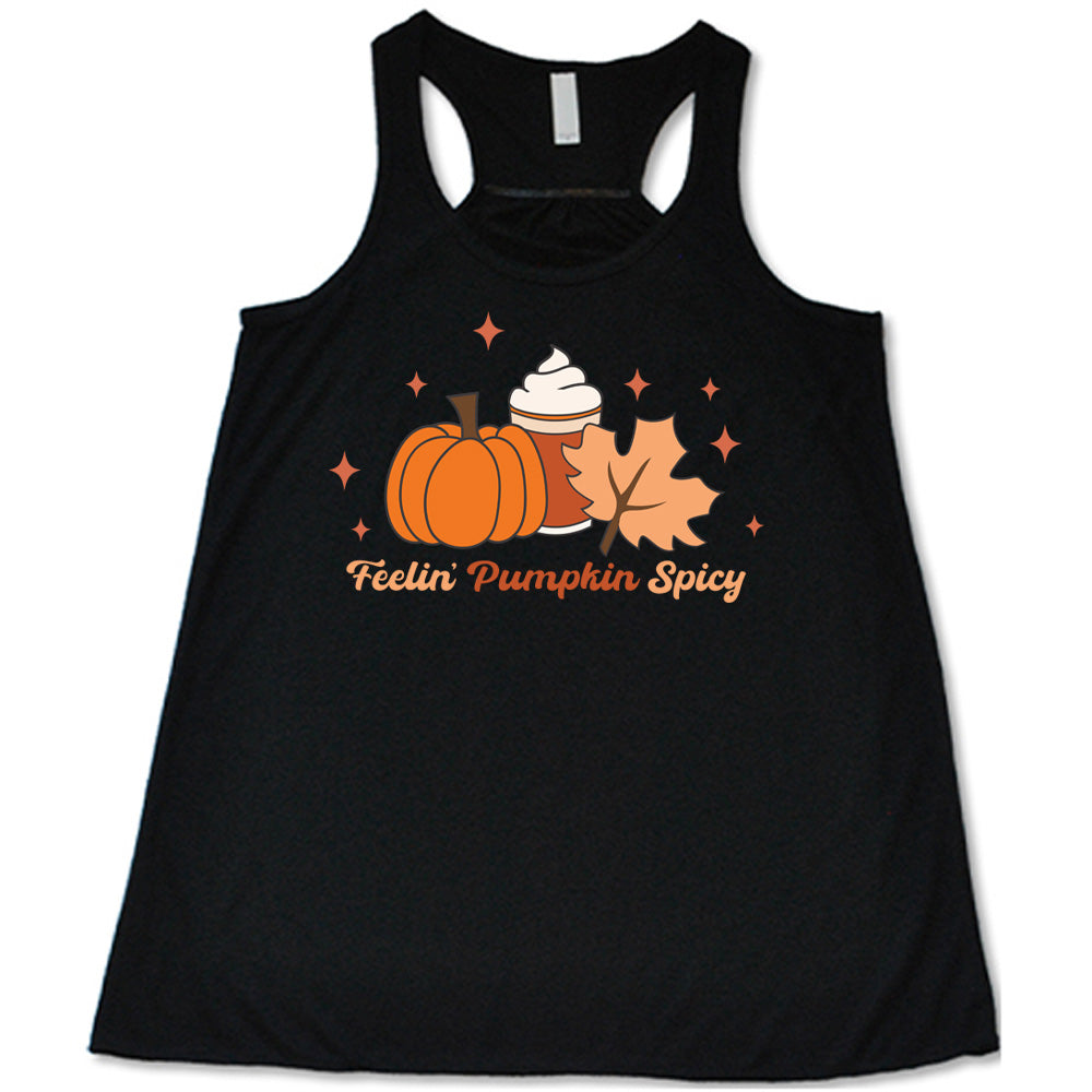 Black colored flowy tank with pumpkin, coffee, and fall leaf graphic on it that says "Feelin' Pumpkin Spicy"