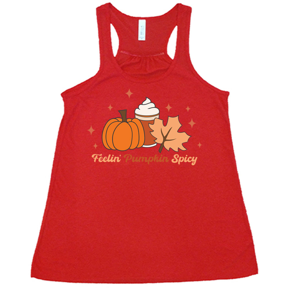 Red colored flowy tank with pumpkin, coffee, and fall leaf graphic on it that says "Feelin' Pumpkin Spicy"
