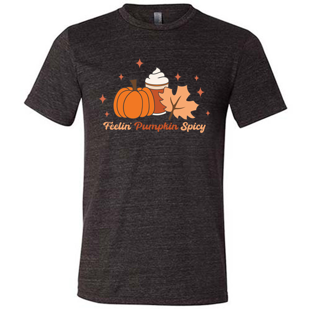 Black colored shirt with pumpkin, coffee, and fall leaf graphic on it that says "Feelin' Pumpkin Spicy"