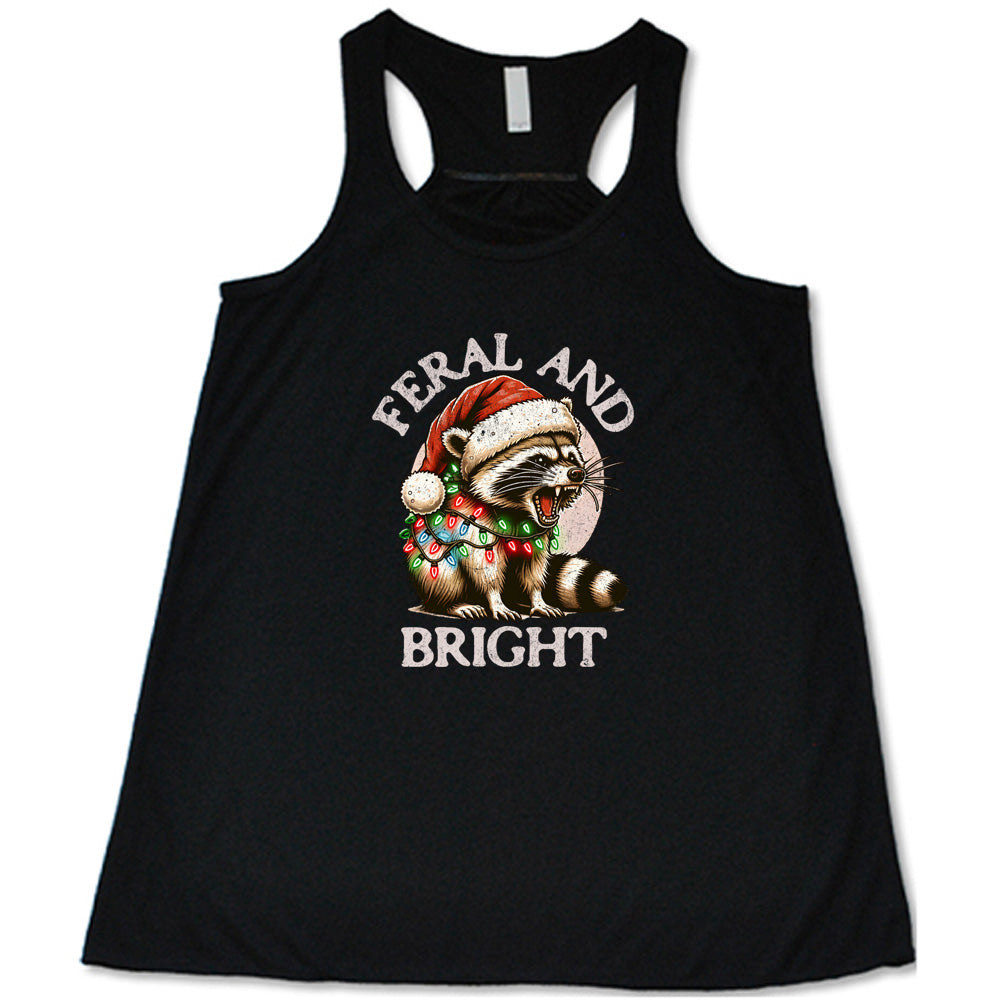 black shirt with the text "Feral And Bright" with a raccoon graphic on it