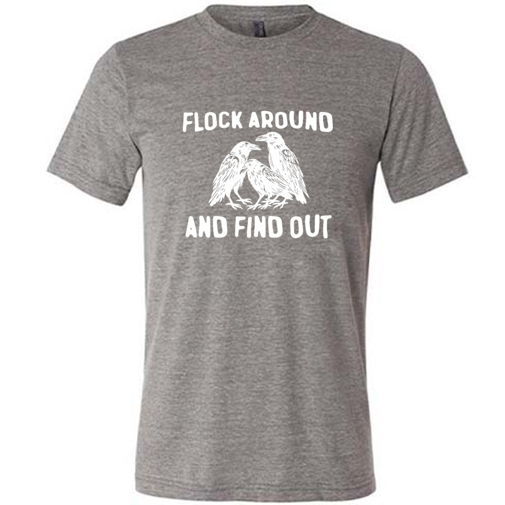 Grey colored shirt with flock of birds graphic on it that says "Flock Around And Find Out"