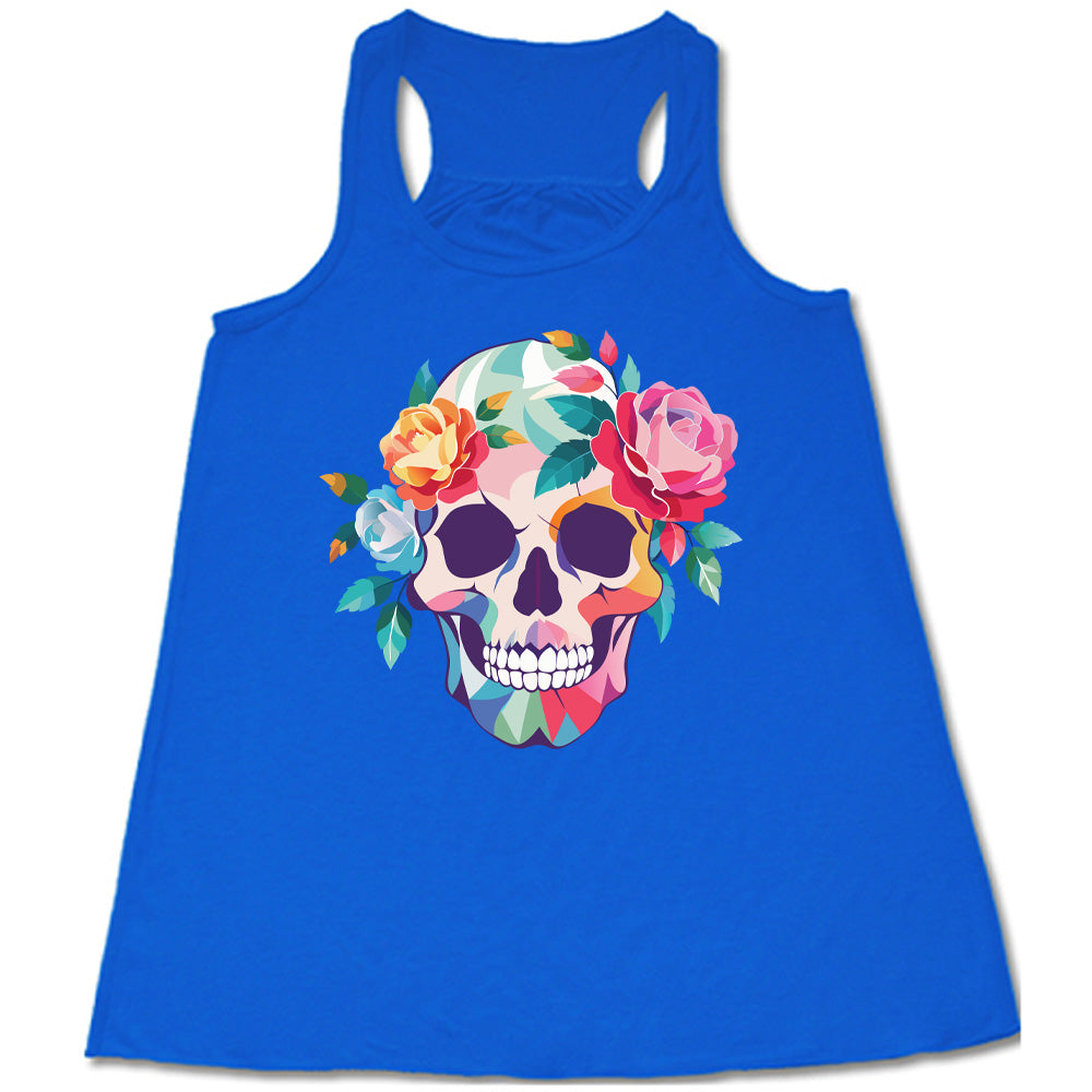 blue flowy racerback tank with the colorful graphic of a skull, with flowers adorning it's head