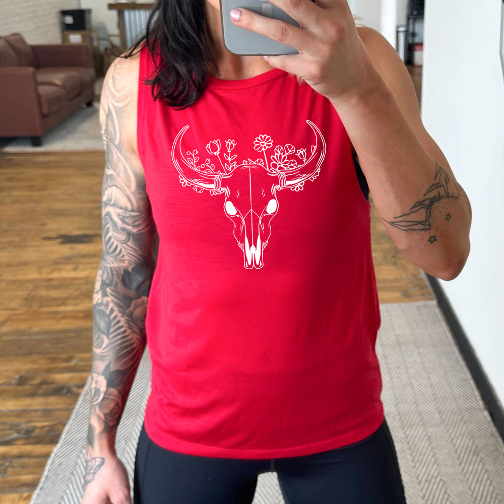 red muscle tank with a floral cow skull graphic on it
