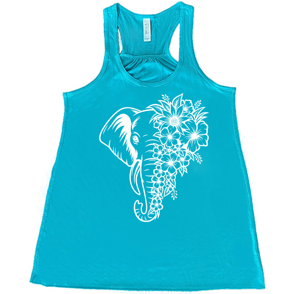 teal racerback tank with the graphic of an elephant's head, with half of its head made up only of tropical flowers